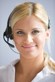 Portrait of Business woman wearing telephone heads